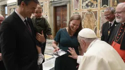 Pope Francis blesses an unborn baby during the Papal Foundation's annual pilgrimage in Rome on Friday, April 12, 2024. / Credit: Vatican Media