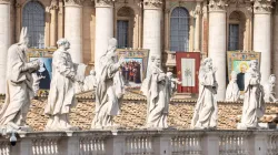 Statuary sits before imagery of the recently canonized saints in St. Peter's Square at the Vatican, Sunday, Oct. 20, 2024 / Credit: Daniel Ibáñez/CNA