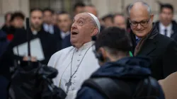 Pope Francis gazes up at the bronze statue of Mary atop the 39.4-foot column at Rome's Spanish Steps, Dec. 8, 2024. / Credit: Daniel Ibáñez/CNA