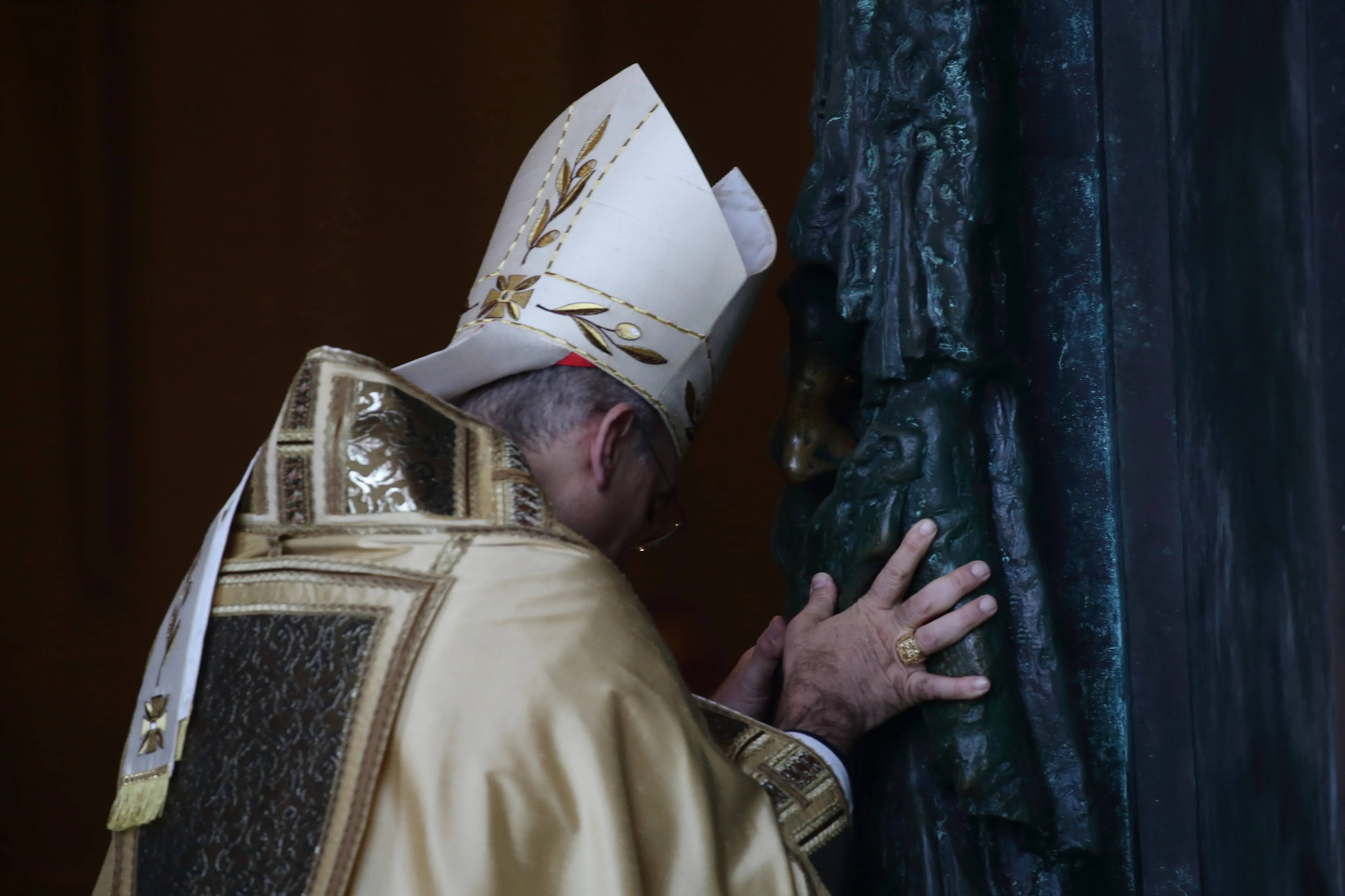 Cardinal Baldassare Reina ceremonially pushes open the Holy Door at St. John Lateran on Dec. 29, 2024. / Credit: Evandro Inetti/EWTN/Vatican Pool