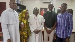 Formerly detained Father Oliver Opara (left) with Ummi Hassan; Bishop Matthew Kukah of the Diocese of Sokoto (not an abductee); Father Stephen Ojapah; and Hassan Fareed Hassan after the four were released from being held captive by terrorists. Photo courtesy of the Diocese of Sokoto