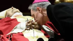 Archbishop Georg Gänswein bent down to kiss the hands of his friend and mentor, Pope Emeritus Benedict XVI. | Vatican Media