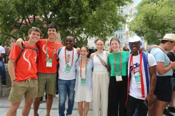 James Nyumah, 23, from Liberia, (pictured third from left) hangs out with new friends from Australia while attending a "Rise Up" session at World Youth Day 2023 in Lisbon, Portugal, on Aug. 2, 2023. | Hannah Brockhaus/CNA