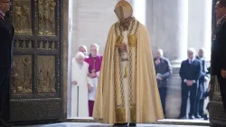 Pope Francis prays after opening the Holy Door in St. Peters Basilica Dec. 8, 2015 launching the extraordinary jubilee of mercy. LOsservatore Romano.