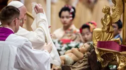 Pope Francis uncovers the Child Jesus in St. Peter's Basilica Dec. 24, 2019. Credit: Daniel Ibanez/CNA.