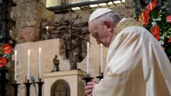 Pope Francis prays at the tomb of St. Francis of Assisi Oct. 3, 2020. Credit: Vatican Media.