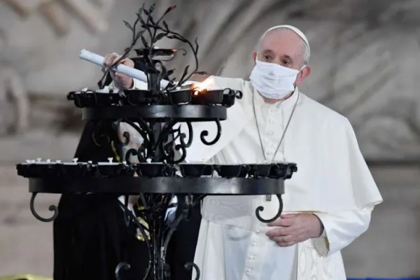 Pope Francis light a candle during an interreligious ceremony in the Campidoglio Square, Rome, Oct. 20, 2020. / Vatican Media