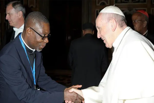 Mons. Joseph Kakou Aka greets Pope Francis in Rome. Credit: Courtesy Photo