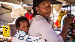 A young mother carrying her baby at  Salesian shelter for underage single mothers in Luanda, Angola. / Agenzia Info Salesiana (ANS)