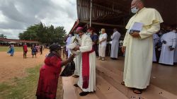 Archbishop Valerian Okeke distributing relief materials to the less privileged in a ceremony at the Basilica of the Most Holy Trinity Onitsha, Nigeria. / Archdiocese of Onitsha