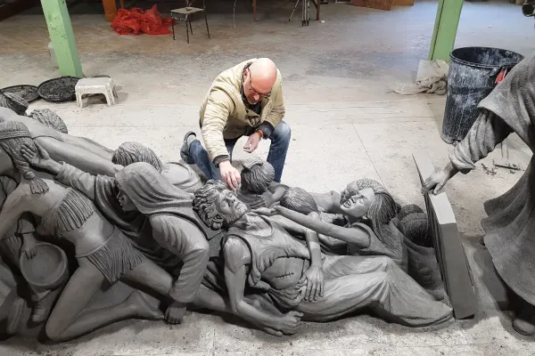 Timothy P. Schmalz with his sculpture ‘Let the Oppressed Go Free.’. Courtesy of Timothy P. Schmalz.