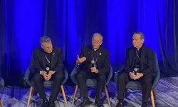 USCCB president Archbishop Timothy Broglio (left); Bishop Mark Seitz, head of the USCCB migration committee (center); and Bishop Michael Burbidge, chairman of the USCCB’s pro-life committee, speak to media at the USCCB fall plenary assembly on Nov. 12, 2024.   / Credit: Jonathan Liedl