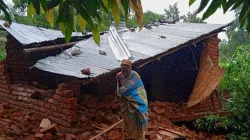 An elderly woman in front of her destroyed house in TA Mlumbe Zomba. Credit: CADECOM