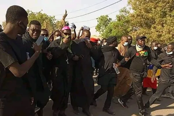 Archbishop Edmond Djitangar surrounded by young people, during the "march for dignity and justice" on the occasion of the commemoration of the victims of Sandana on 15 February 2022. Credit: Vatican Media