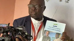 Caritas Freetown Executive Director Fr. Peter Konteh presents the Sierra Leone Election Pledge. Credit: Caritas Freetown Media team