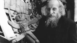 Father Carlo Crespi Croci (1891-1982) holding a crucifix from his ethnographic collection in Cuenca, Ecuador. | Credit: Salesianos de Don Bosco, CC BY-SA 4.0, via Wikimedia Commons