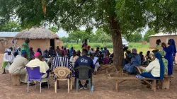 CRS officials and Bishop emeritus Vincent Sowah Boi-Nai meet members of Zakoli community following attack. Credit: CRS