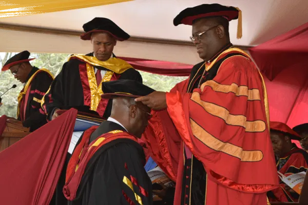 The University Chancellor, Rt. Rev. Charles Kasonde confers a doctorate degree to a graduand during the 38th Graduation at the Catholic of Eastern Africa, Langata, Oct 25, 2019 . / Catholic University of Eastern Africa (CUEA)