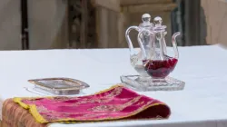 Ampules, glass cruets with wine and water for Holy Mass. Credit: Thoom via Shutterstock