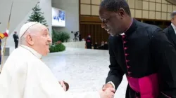 Mons. Julien Kaboré greeting Pope Francis in Rome. Credit: Vatican Media