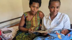 Laurence (left) after delivering her baby Keilla Credit: Human Life International