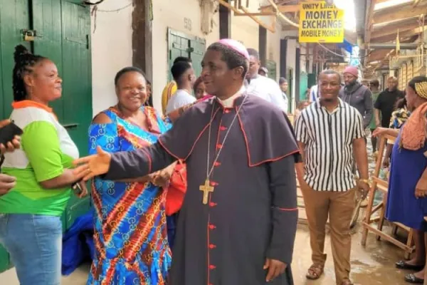 Archbishop Andrew Fuanya Nkea of the Catholic Archdiocese of Bamenda in Cameroon offering words of comfort to persons affected by the fire disaster that razed hundreds of shops at the central market in his Metropolitan See last month. Credit: Bamenda Archdiocese