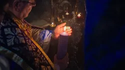 The custos of the Holy Land, Father Francesco Patton, lights the first candle of the Advent wreath at the site of the manger inside the Nativity Grotto on Nov. 30, 2024, during the first vespers of the first Sunday of Advent. / Credit: Marinella Bandini