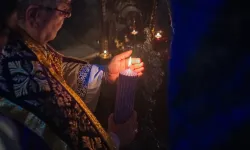 The custos of the Holy Land, Father Francesco Patton, lights the first candle of the Advent wreath at the site of the manger inside the Nativity Grotto on Nov. 30, 2024, during the first vespers of the first Sunday of Advent. / Credit: Marinella Bandini