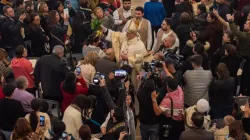 Latin Patriarch of Jerusalem Cardinal Pierbattista Pizzaballa blesses the people with the water he previously collected from the River Jordan. The cardinal presided over the Mass of the Feast of Baptism, on Friday, January 12, near the Jordan River. | Credit: Marinella Bandini