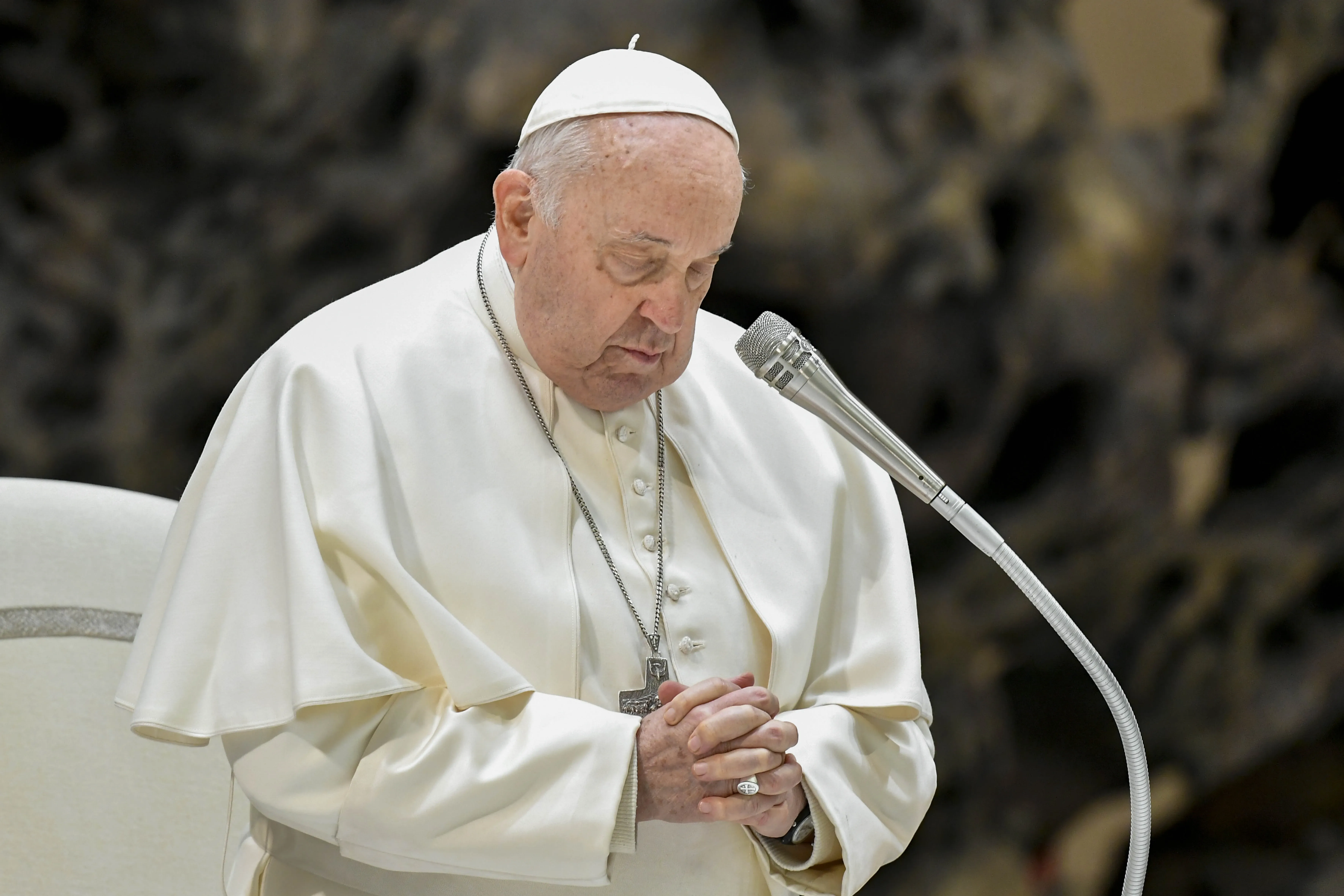 Pope Francis prays at his general audience Dec. 20, 2023, in Paul VI Hall at the Vatican. / Credit: Vatican Media