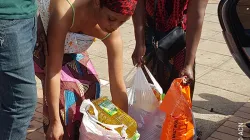 A woman receiving aid at a refugee center in South Africa. Credit: Aid to the Church in Need (ACN)