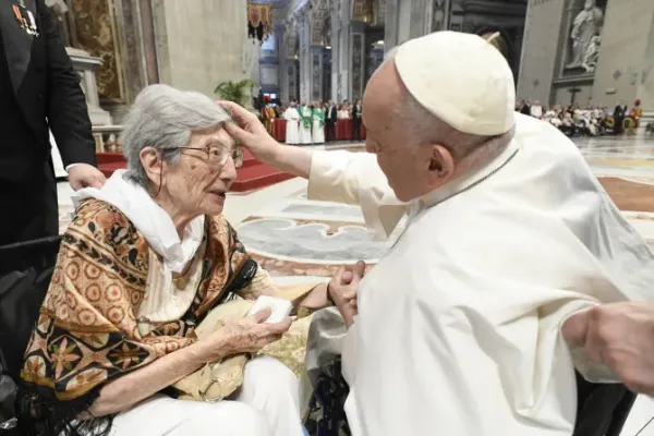 Pope Francis blesses a woman in St. Peter's Basilica, where he presided over a special papal Mass on July 23, 2023, marking the third annual World Day for Grandparents and the Elderly. | Vatican Media