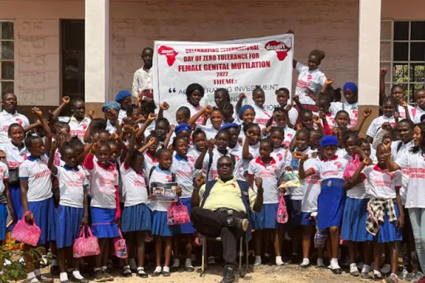 Fr. Peter Konteh (seated), poses for a photo session with beneficiaries of Desert Flower Foundation- Sierra Leone on the celebrations of International Day of Zero Tolerance for Genital Mutilation. Credit: Fr. Peter Konteh