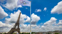 The Olympic flag flutters during a practice session at Eiffel Tower Stadium in Paris on July 24, 2024, ahead of the 2024 Olympic Games. / Credit:  ODD ANDERSEN/AFP via Getty Images