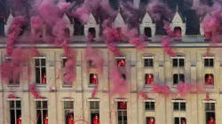 Smoke billows near windows as performers participate in the opening ceremony of the Paris 2024 Olympic Games in Paris on July 26, 2024. / Credit: BERNAT ARMANGUE/POOL/AFP/Getty Images