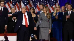 Republican presidential nominee former president Donald Trump points to supporters with former first lady Melania Trump during an election night event at the Palm Beach Convention Center on Nov. 6, 2024, in West Palm Beach, Florida. / Credit: Joe Raedle/Getty Images