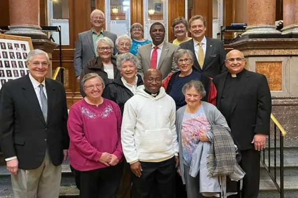 Fr. Raphael Assamah with some Iowa legislators. Credit: Accra Archdiocese