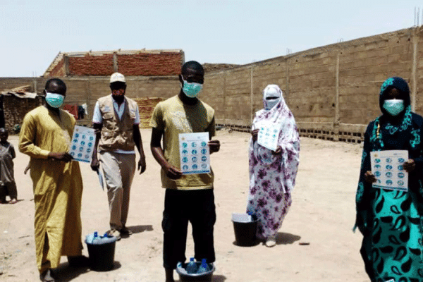 JRS teachers in Chad with some of the posters and information materials they are using to create awareness about COVID-19 among the refugee communities. / Jesuit Refugee Service (JRS)