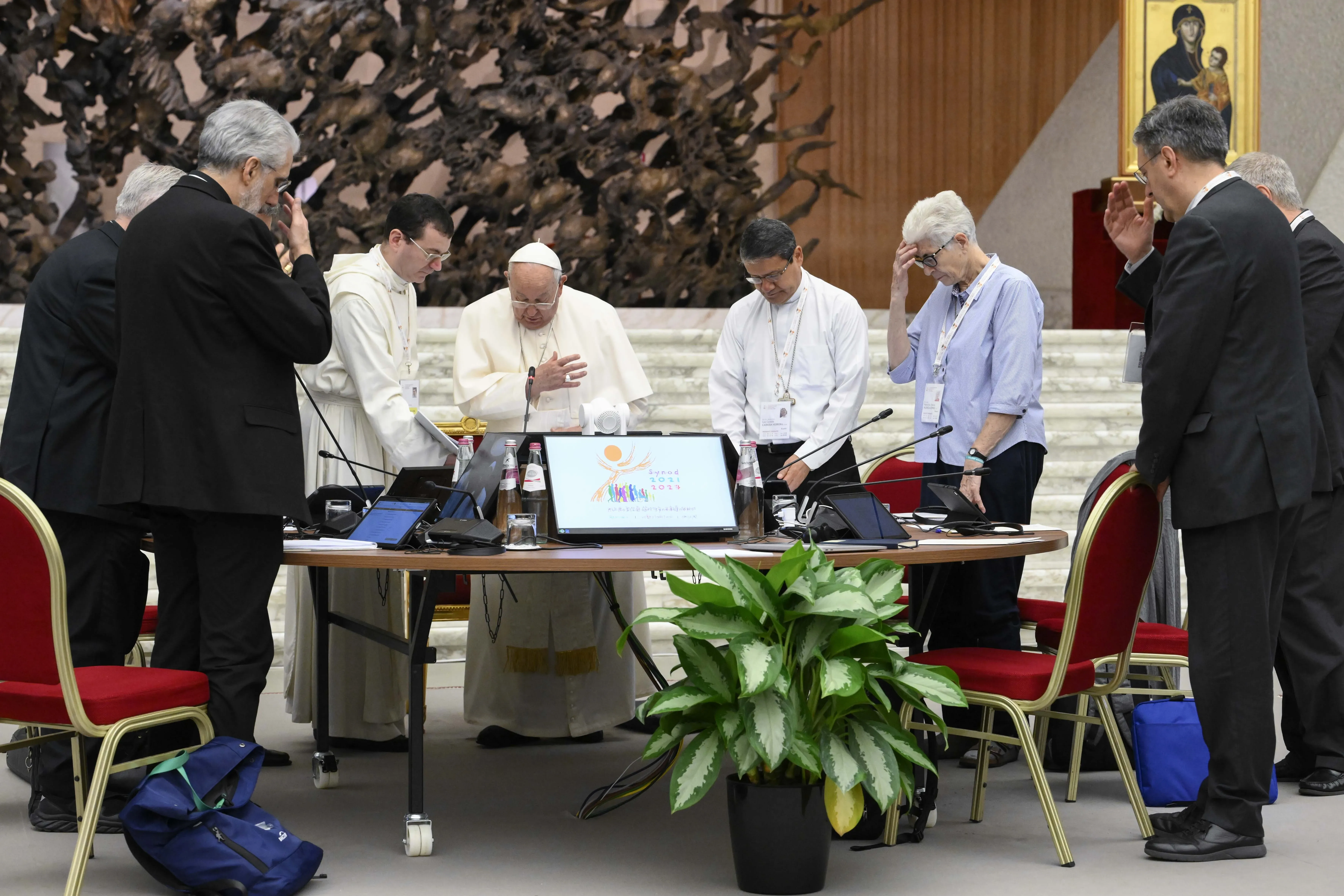 Pope Francis prays with members of the Synod on Synodality during one of its meetings in the Vatican's Paul VI Hall on the morning of Oct. 12, 2024. / Credit: Vatican Media