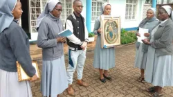 Mother Superior of the Congregation of Sisters of Charity of the Immaculate Conception of Ivrea in Nairobi, Kenya, Sr. Leocadia N. Joseph (holding the miraculous image), poses for a photo together with other sisters and lay Victor Isaacs outside their convent in Westlands, Nairobi after receiving the Miraculous image of Mary from Tanzania. Credit: ACI Africa.