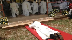 A seminarian lays prostrate during his diaconate ordination / Bishop James Maria Wainaina/ Facebook