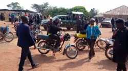 Police and residents of Wumat, a farming town 45 miles south of Jos, Nigeria, arrive to survey damage and help survivors of a terrorist attack on Nov 22, 2022. | Courtesy of Victor Nafor