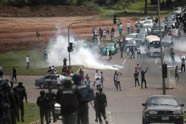 The Nigerian Police Force fires teargas at protesters during a demonstration to press for the scrapping of the Special Ant-Robbery Squad (SARS) on Abuja-Keffi Expressway, Abuja, Nigeria on October 19, 2020. / AFP