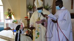 Bishop George Desmond Tambala of the Diocese of Zomba handing over the Bible to Sr. Luciette Marie after she had taken her final vows. / Diocese of Zomba