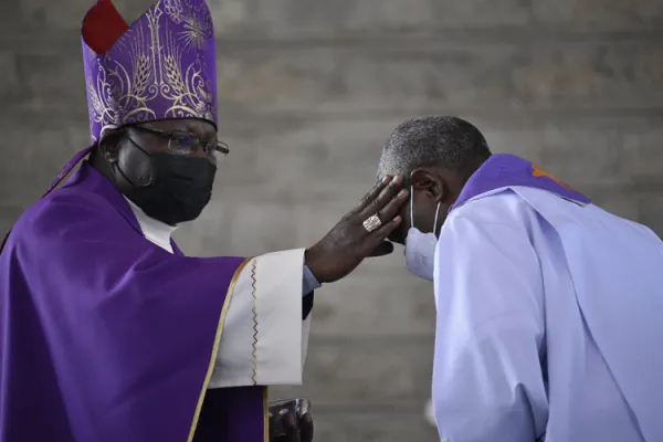 Bishop John Oballa Owaa places ashes on a Priest's forehead during Ash Wednesday Mass. Credit: Ngong Diocese