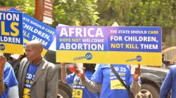 Protesters holding placards in Nairobi against ICPD25 on the eve of the convention on November 11, 2019