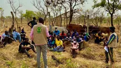 Community workers at Don Bosco Refugee Services Palabek take refugees at Palabek Refugee Settlement through farming lessons in preparation for the 'Rebuilding Lives' agribusiness project / Fr. Lazar Arasu/ Don Bosco Refugee Services Palabek