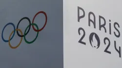 A banner bears the signs of the 2024 Paris Olympic Games and the Olympic Rings at the Trocadero in Paris on July 14, 2024. / Credit: STEFANO RELLANDINI/AFP via Getty Images