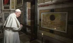 Pope Francis prays near the tomb of Father Pedro Arrupe, SJ, superior general of the Society of Jesus between 1965 and 1981, during a Mass at the Jesuit Church of the Most Holy Name of Jesus, known as the “Gesu” in Rome, Italy, on March 12, 2022, on the 400th anniversary of the canonization of St. Ignatius of Loyola, the society’s founder. / Credit: Vatican Media/Abaca/Sipa USA/Sipa via AP Images