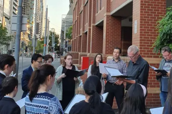 Christmas Eve carolers for Cardinal Pell gathered at Melbourne prison